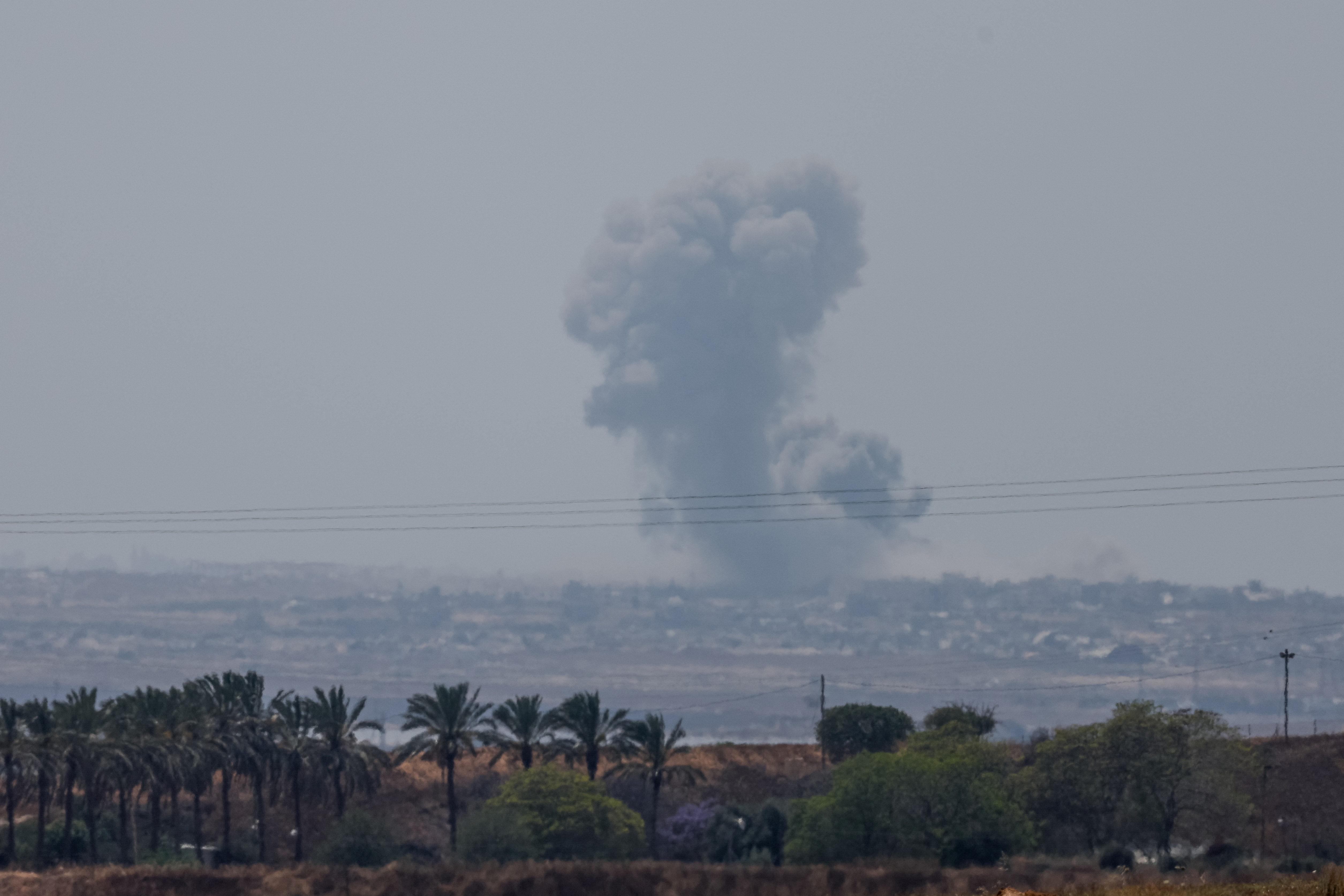 Smoke rises over Gaza following an explosion, as seen from Israel