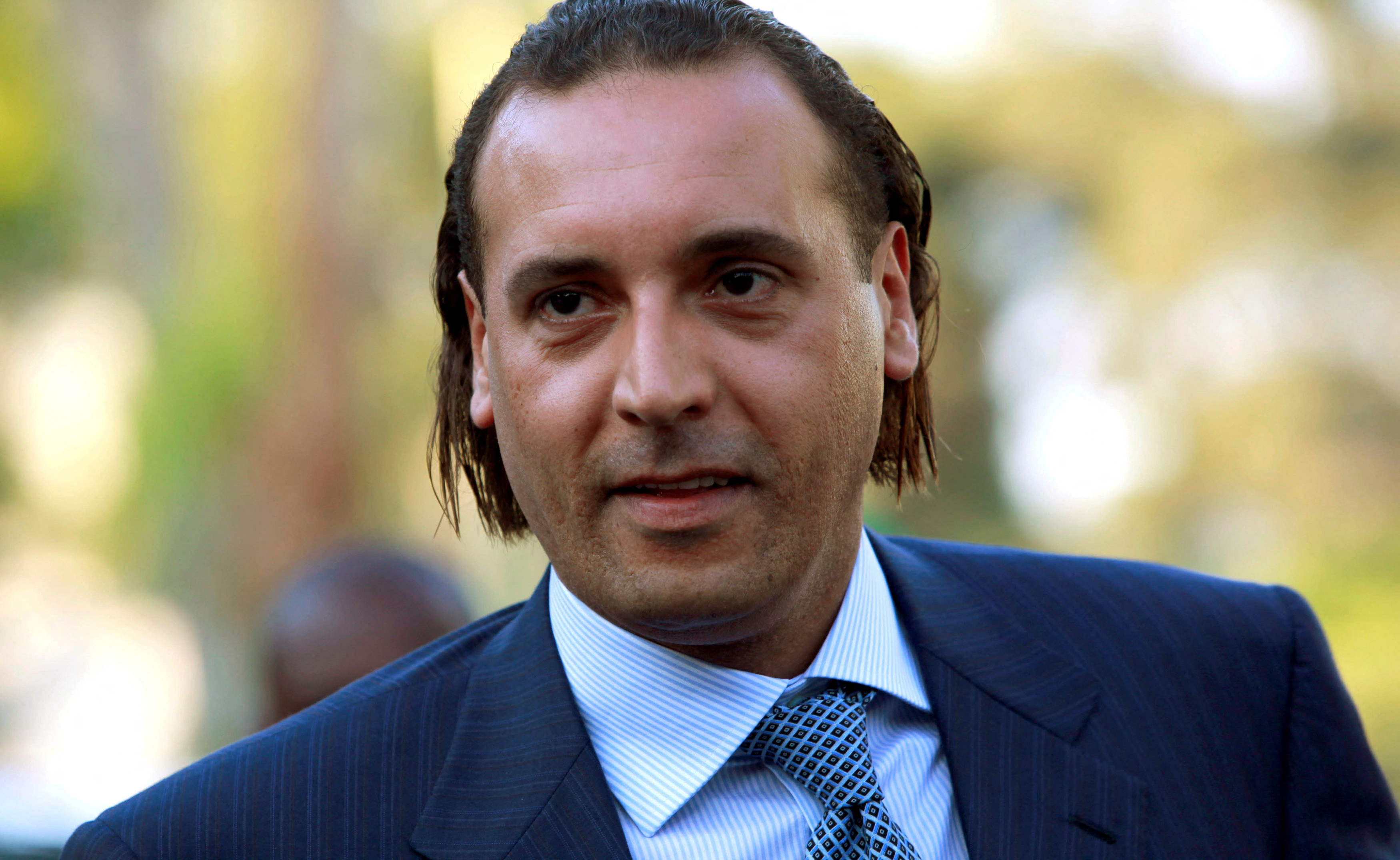 FILE PHOTO: Hannibal Gaddafi attends the signing agreement ceremony between Libya's Shipping Corporation and STX Europe to build a cruise ship, in Tripoli