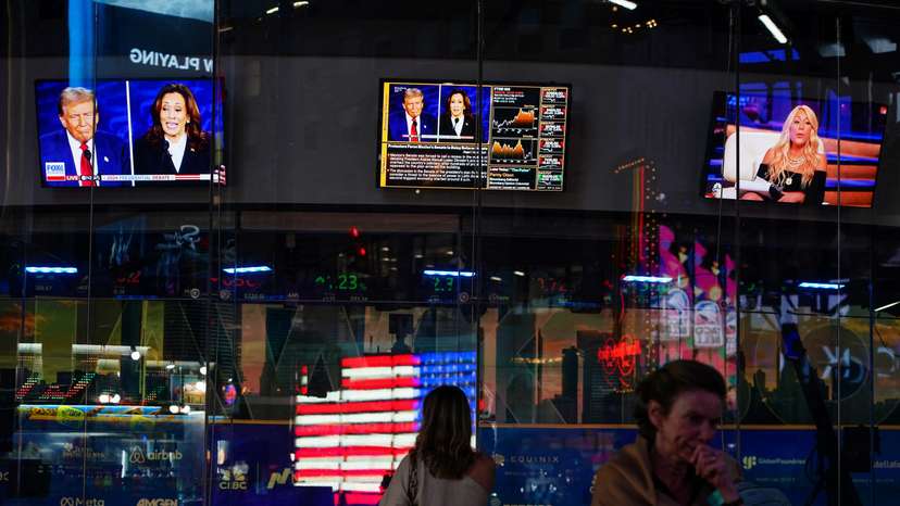 People watch the presidential debate between Trump and Harris, in New York