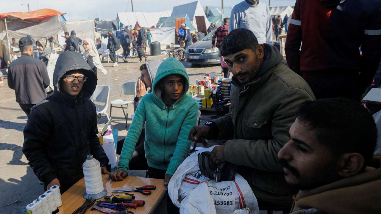 Displaced Gazans turn to cobblers amid shortages of new footwear, in Rafah