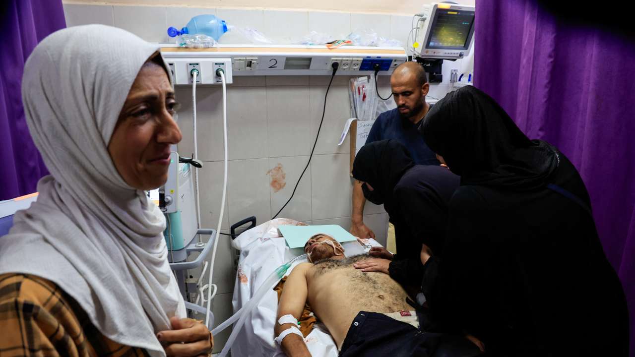 A Palestinian, wounded in an Israeli strike, receives treatment, in Khan Younis