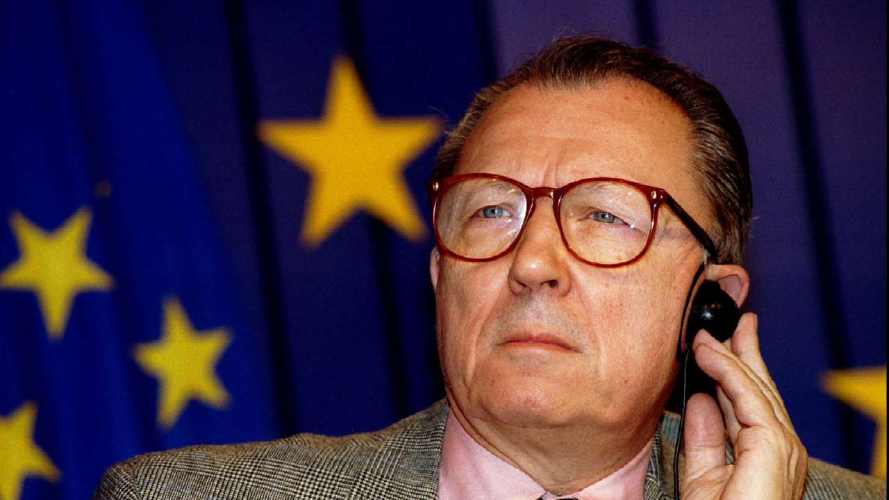 FILE PHOTO: European Union President Jacques Delors listens to a question during a press conference on the book ..