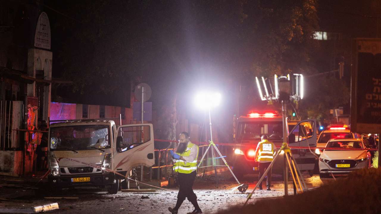 Emergency responders work at the site of a bomb blast in Tel Aviv
