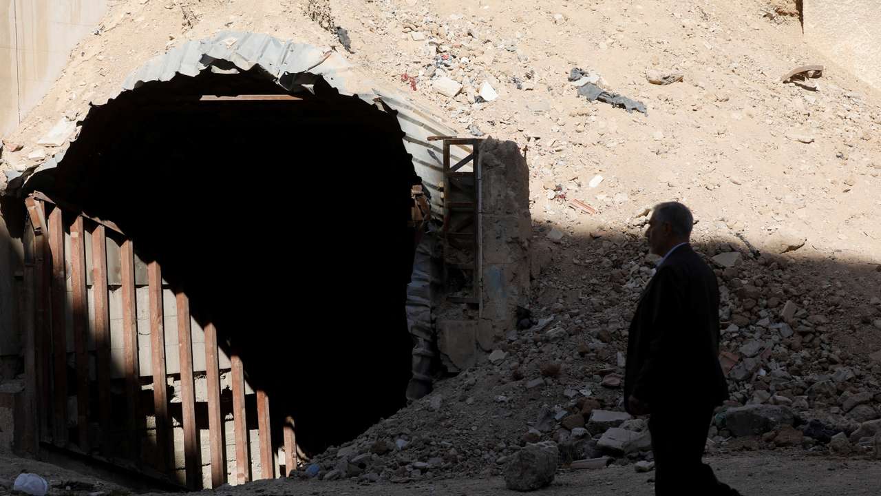 Man walks past a shelter used by residents to protect themselves from attacks in Douma, where a suspected chemical attack took place in 2018 under the rule of Syria's Bashar al-Assad
