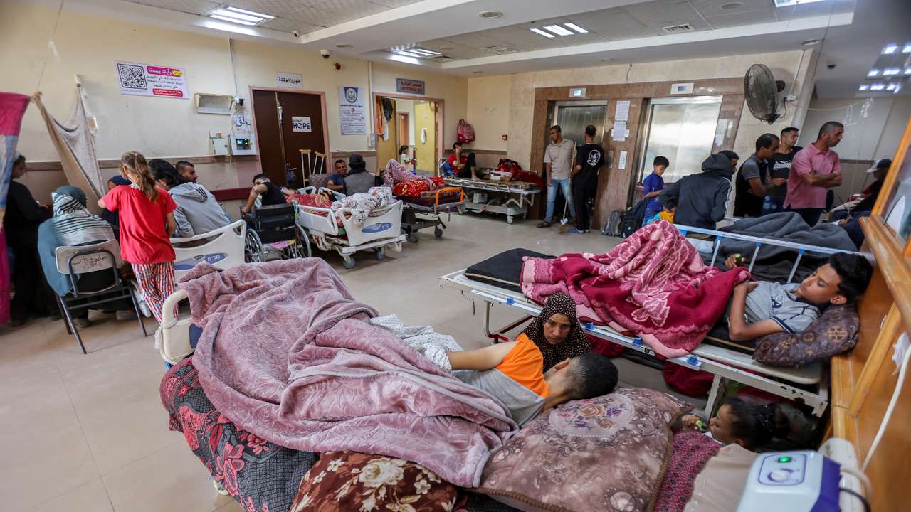 FILE PHOTO: Palestinians wounded in Israeli fire lie on beds as they receive treatment at Al-Aqsa hospital in Deir Al-Balah in the central Gaza Strip