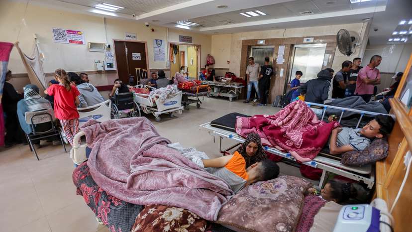 FILE PHOTO: Palestinians wounded in Israeli fire lie on beds as they receive treatment at Al-Aqsa hospital in Deir Al-Balah in the central Gaza Strip