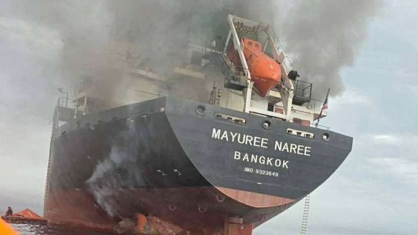 The Thailand-flagged cargo ship Mayuree Naree engulfed in black smoke in the Strait of Hormuz