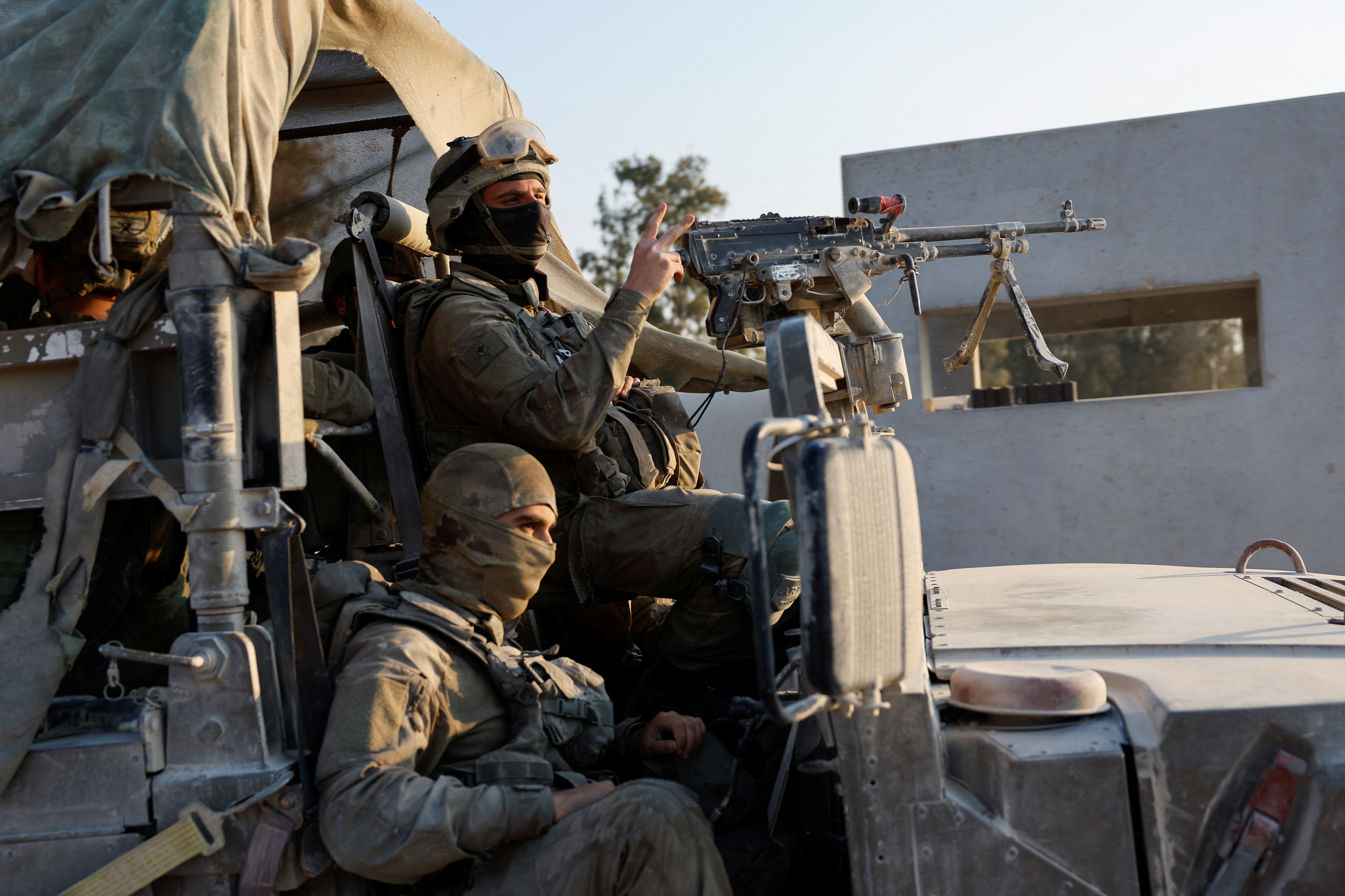 Israeli soldiers prepare to enter Gaza, amid the ongoing conflict between Israel and the Palestinian Islamist group Hamas