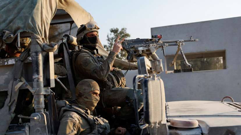 Israeli soldiers prepare to enter Gaza, amid the ongoing conflict between Israel and the Palestinian Islamist group Hamas