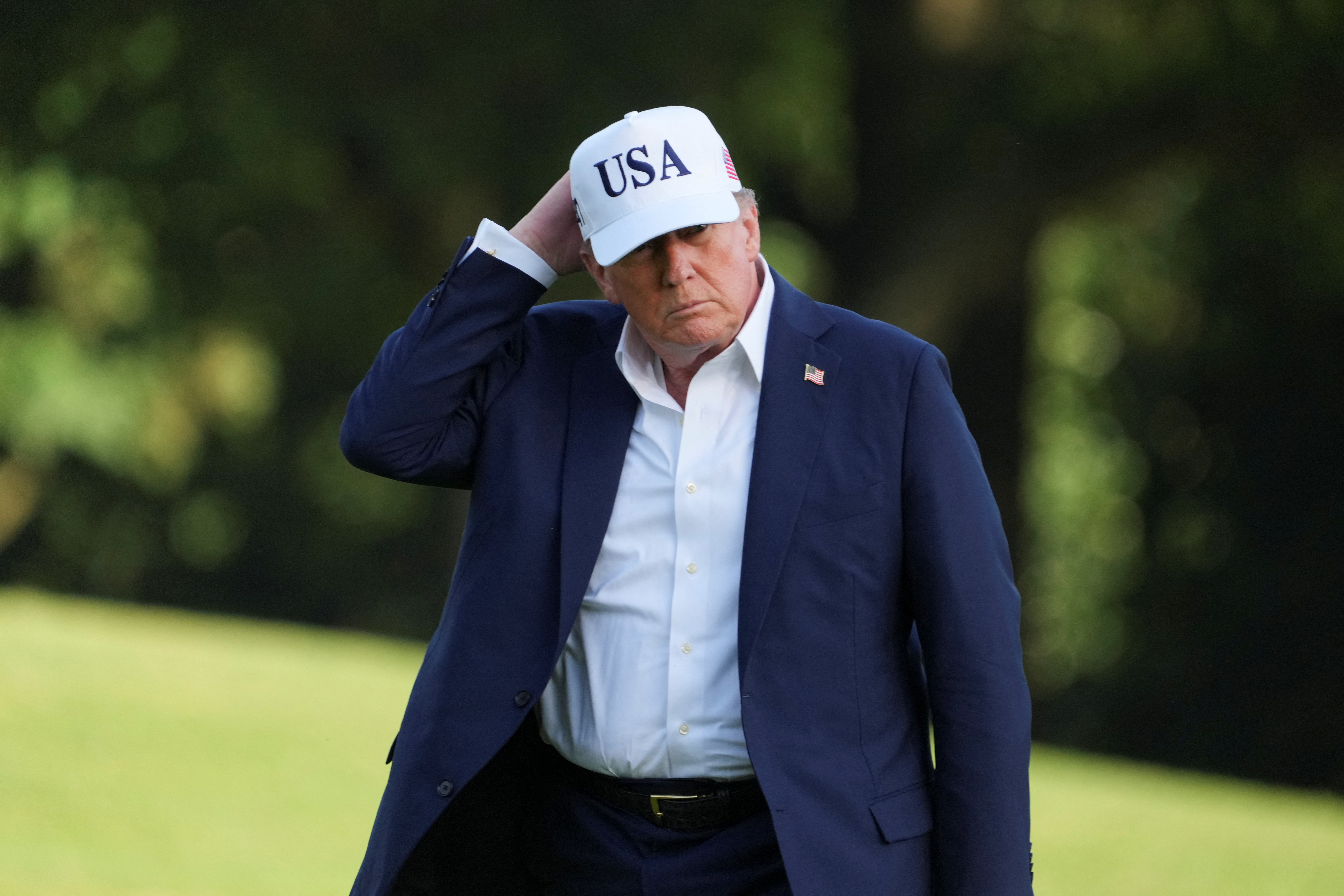 FILE PHOTO: U.S. President Donald Trump arrives at the White House in Washington