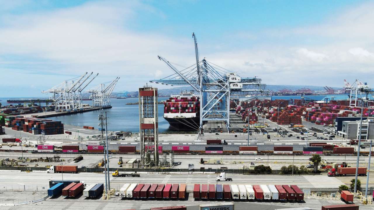 A ship sits docked with containers at the Port of Long Beach in Long Beach, California