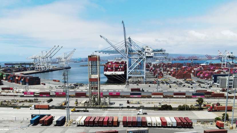 A ship sits docked with containers at the Port of Long Beach in Long Beach, California