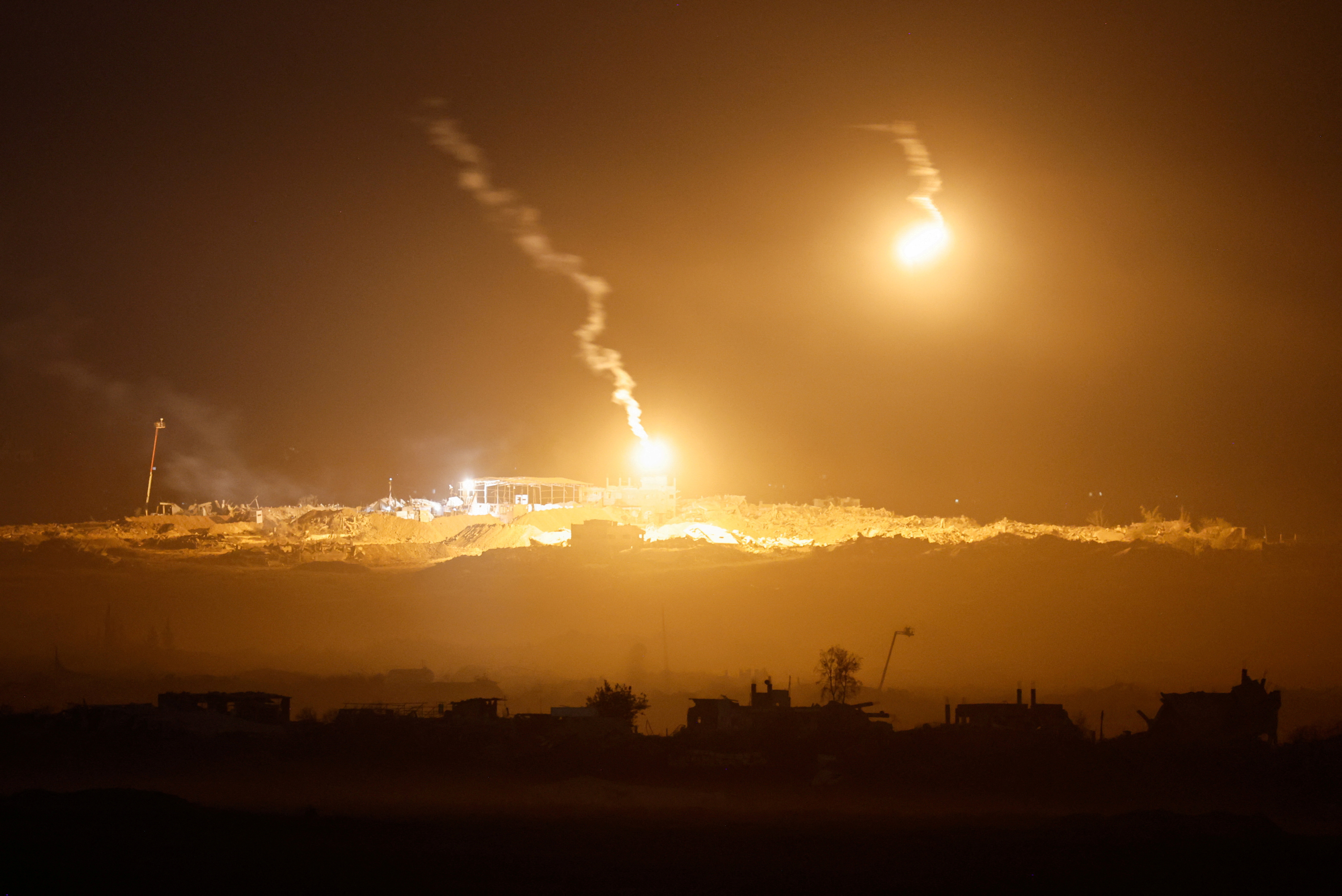 IDF flares light sky above Gaza seen from Israeli side