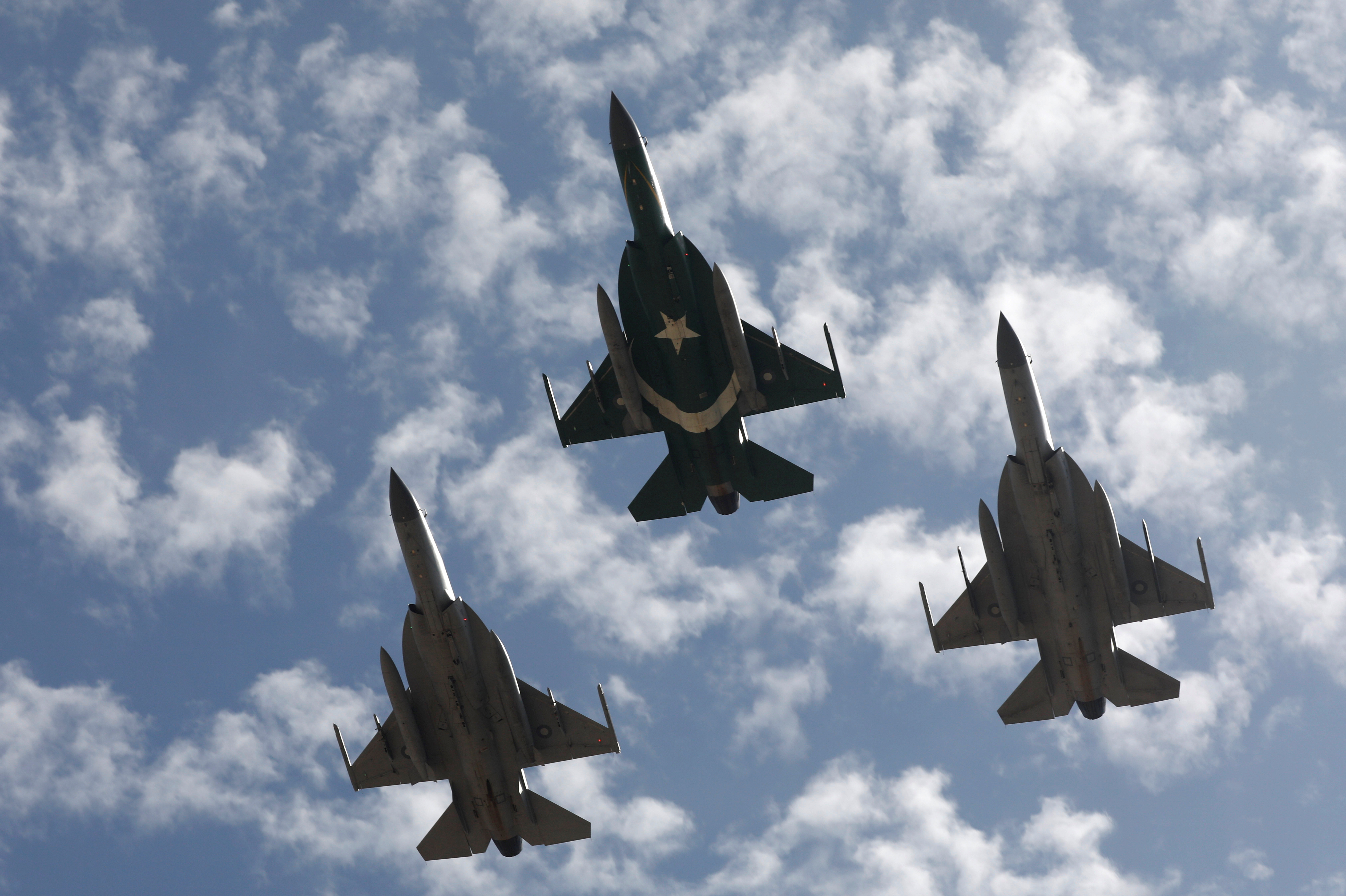 Pakistan Air Force JF-17 Thunder jets perform to commemorate Pakistan Air Force's 'Operation Swift Retort', during an air show in Karachi