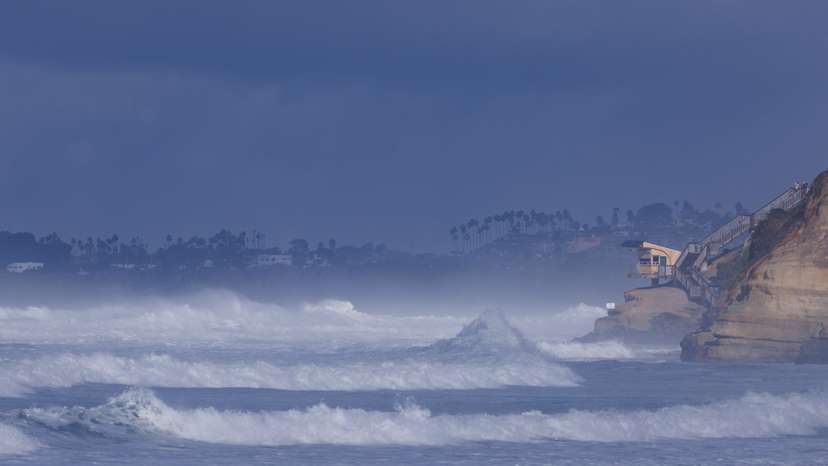 Large ocean waves come ashore in Solana Beach, California