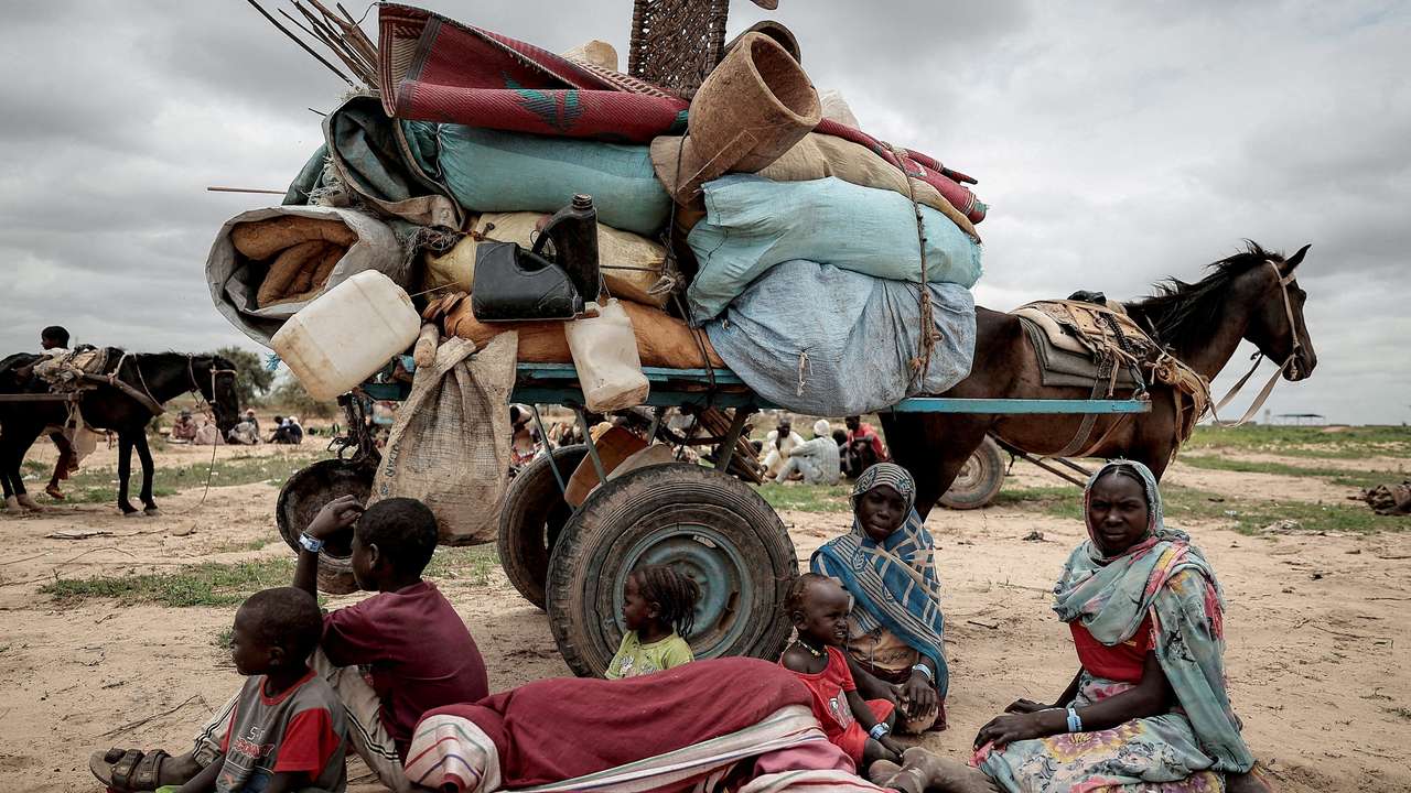 FILE PHOTO: A Sudanese family who fled the conflict in Murnei in Sudan's Darfur region