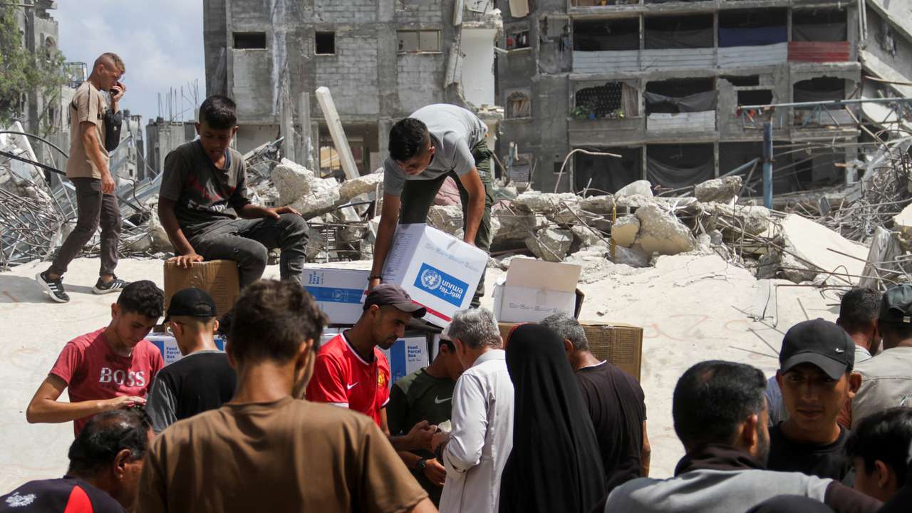 Palestinians gather to receive aid, in Jabalia, northern Gaza Strip