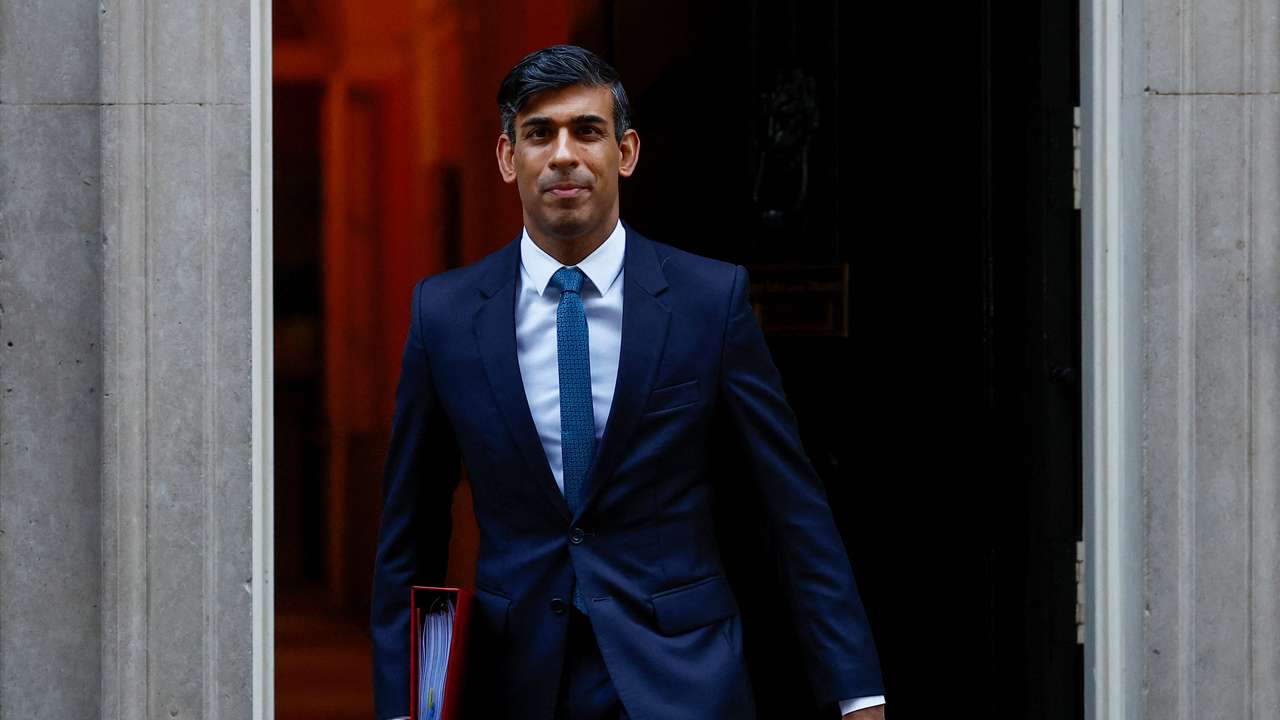 Britain's PM Sunak walks outside 10 Downing Street ahead of PMQs, in London