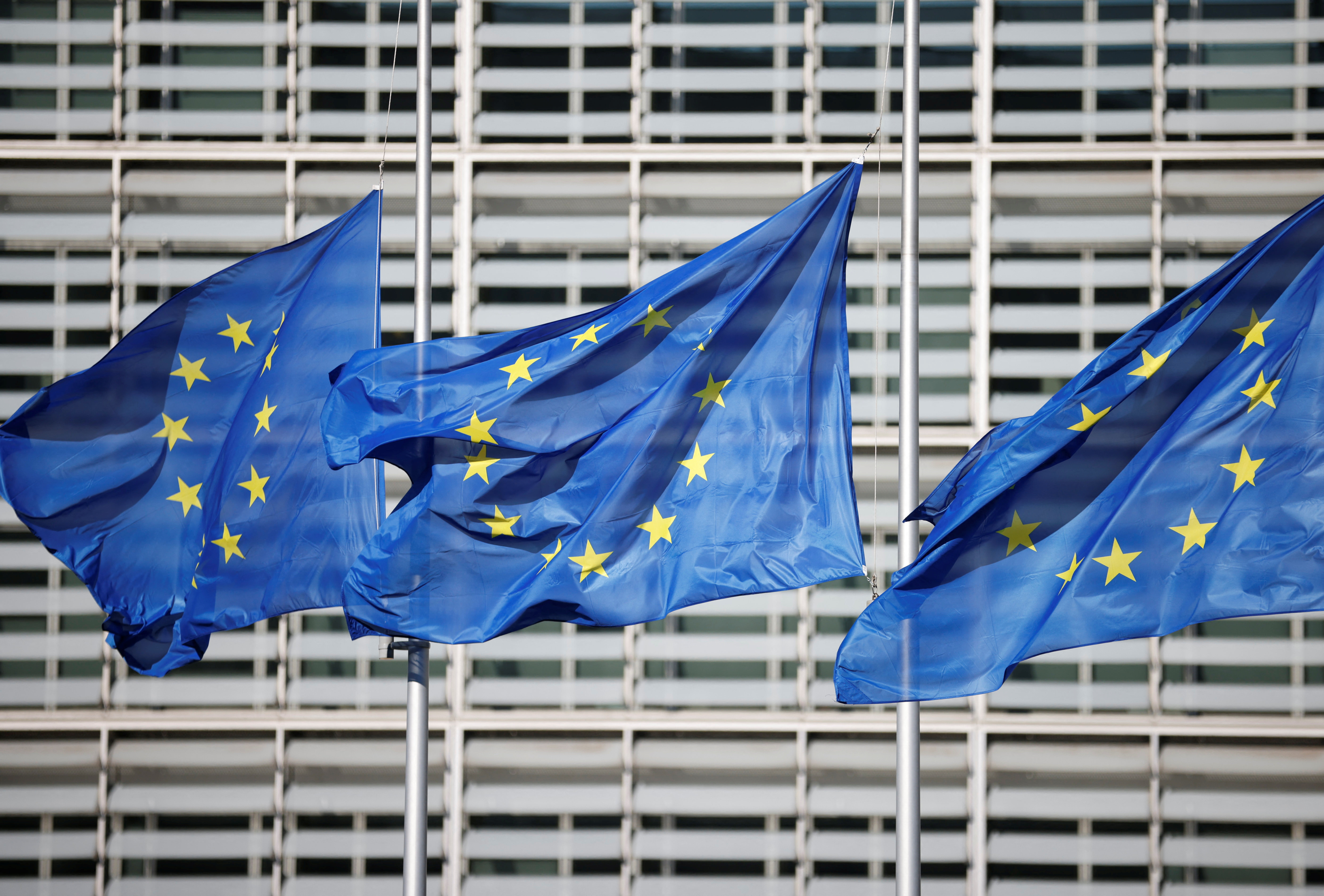European Union flags fly outside the European Commission headquarters in Brussels