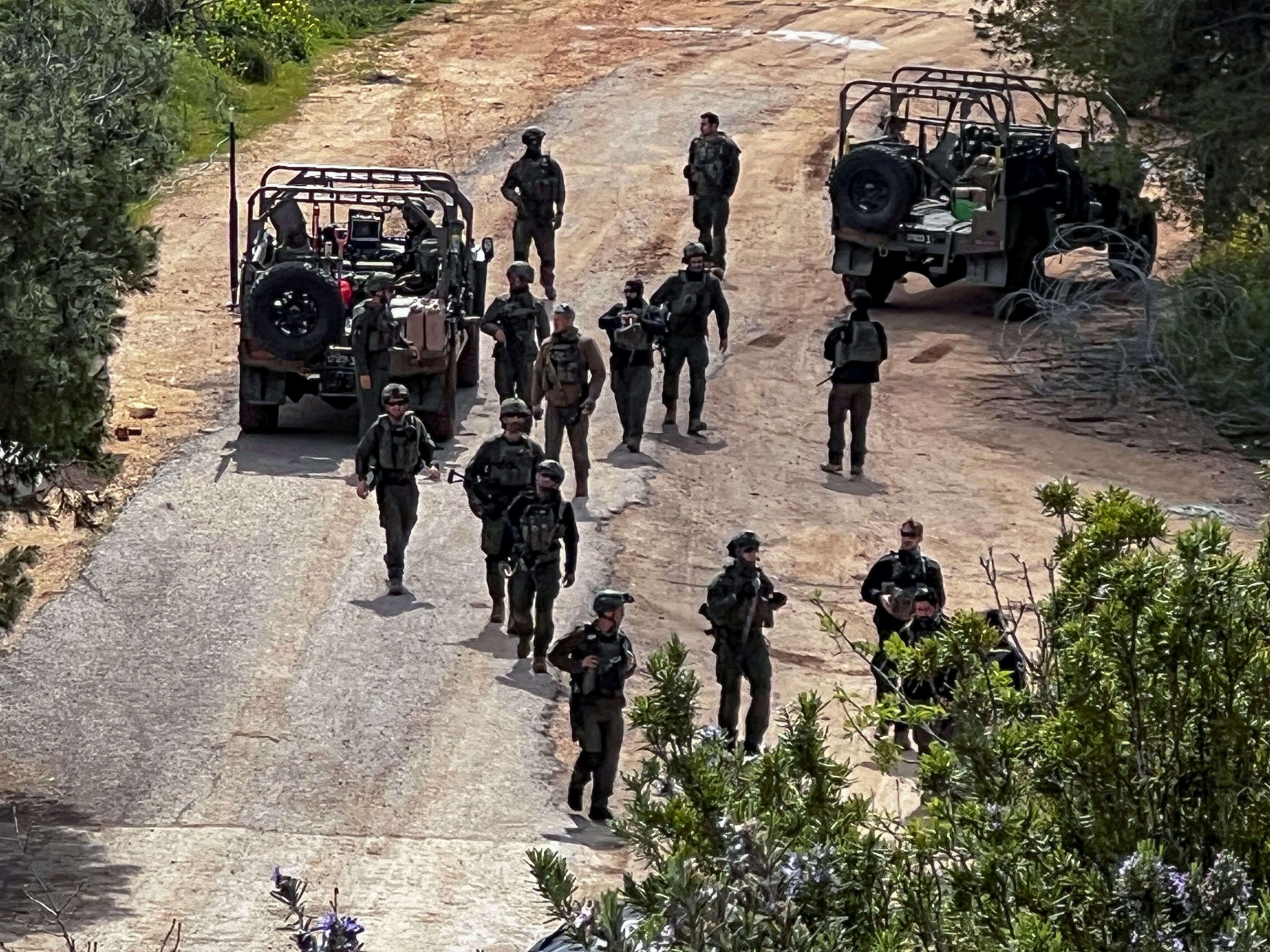 Israeli soldiers in military vehicles on the Israeli side of the Israel-Lebanon border, amid escalation between Hezbollah and Israel, and amid the U.S.-Israeli conflict with Iran, in northern Israel