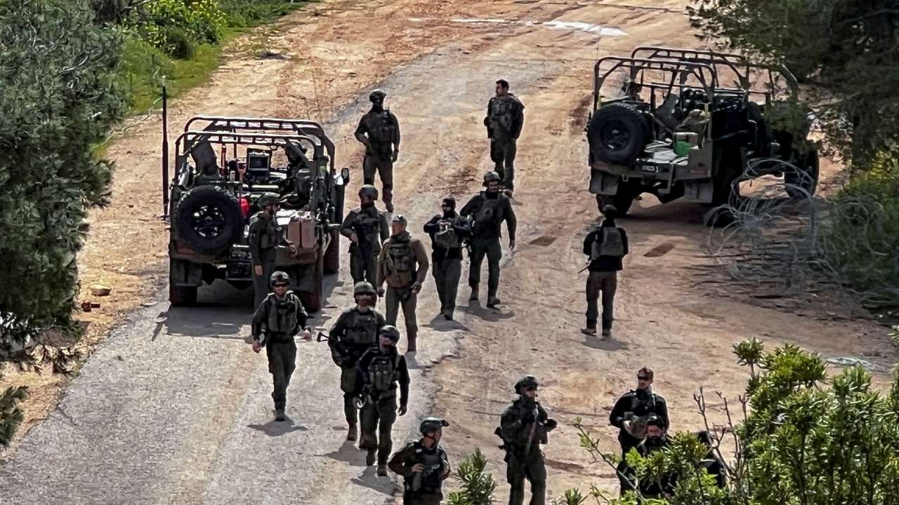 Israeli soldiers in military vehicles on the Israeli side of the Israel-Lebanon border, amid escalation between Hezbollah and Israel, and amid the U.S.-Israeli conflict with Iran, in northern Israel