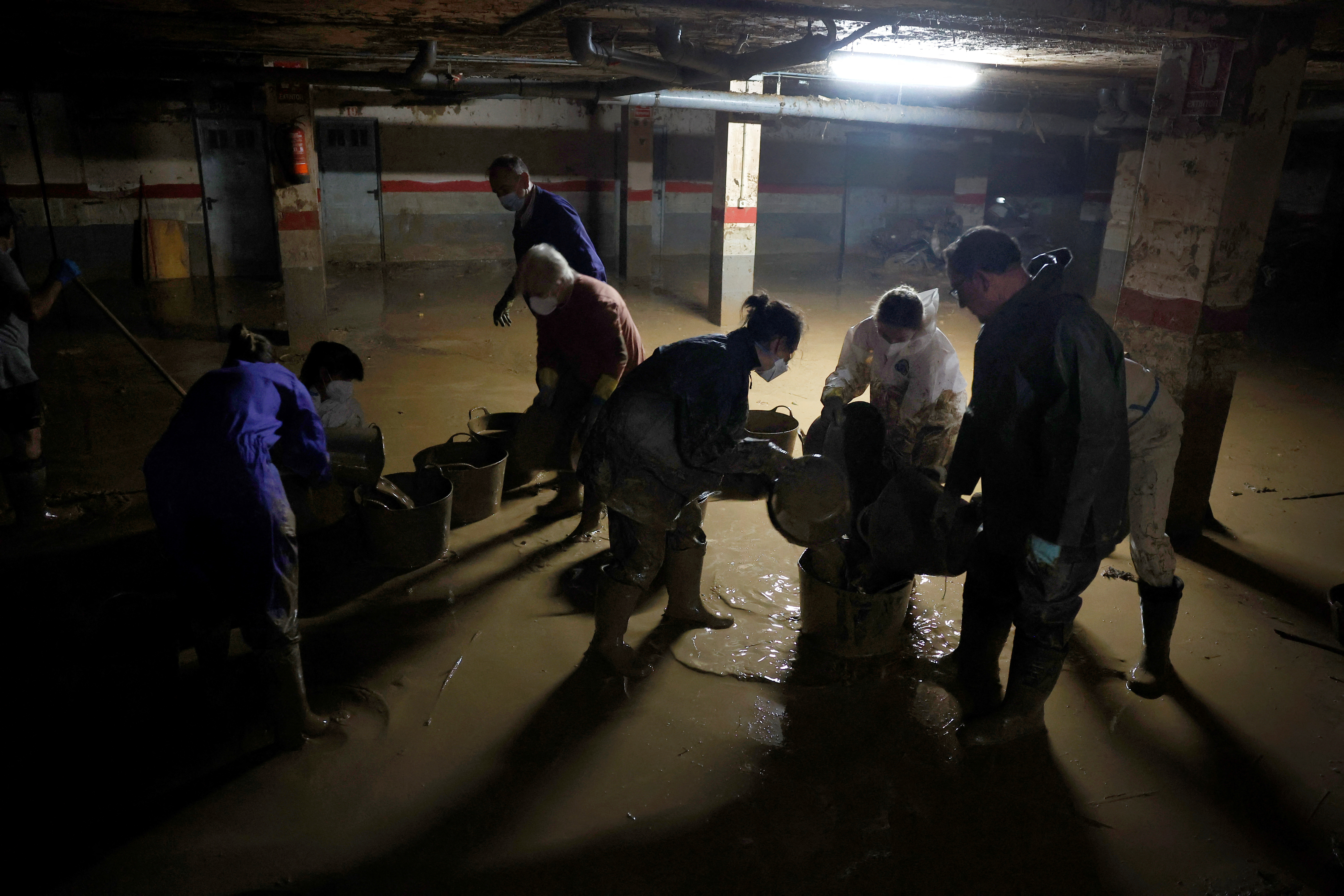 Volunteers continue cleaning up following floods in Valencia