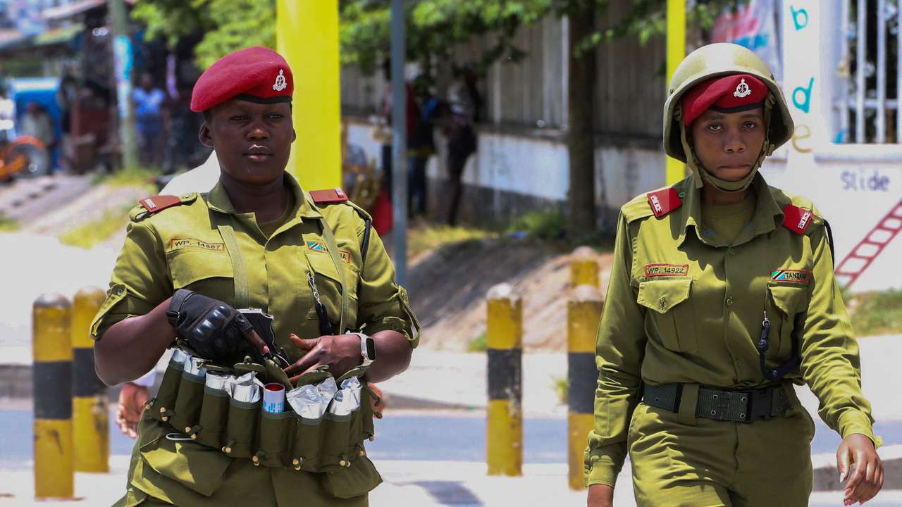 Tanzania riot police officers patrol the streets during the protests to condemn a series of kidnappings and murders in Dar es Salaam