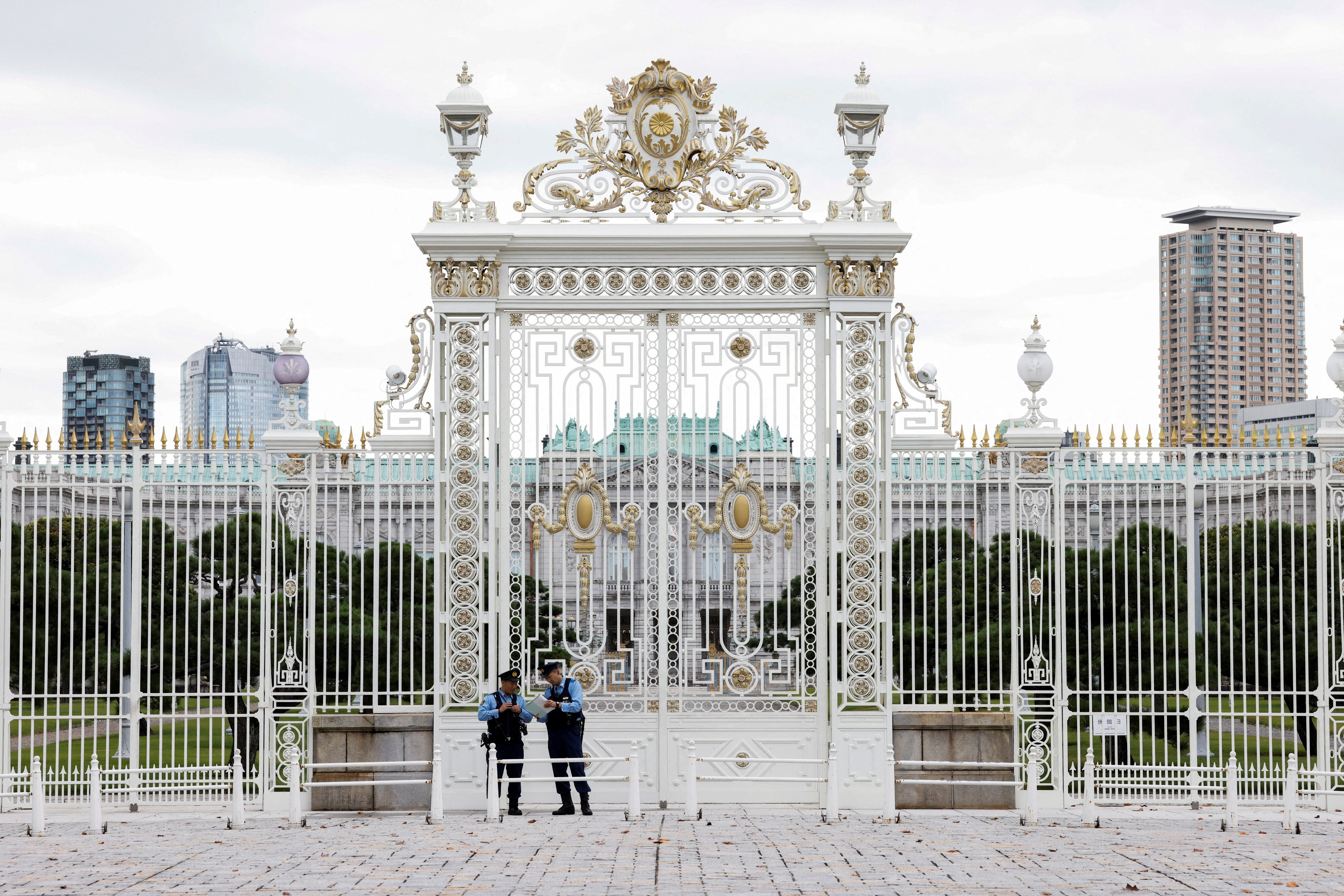 Police officers stand in front of the the Akasaka Palace State Guest House in Tokyo