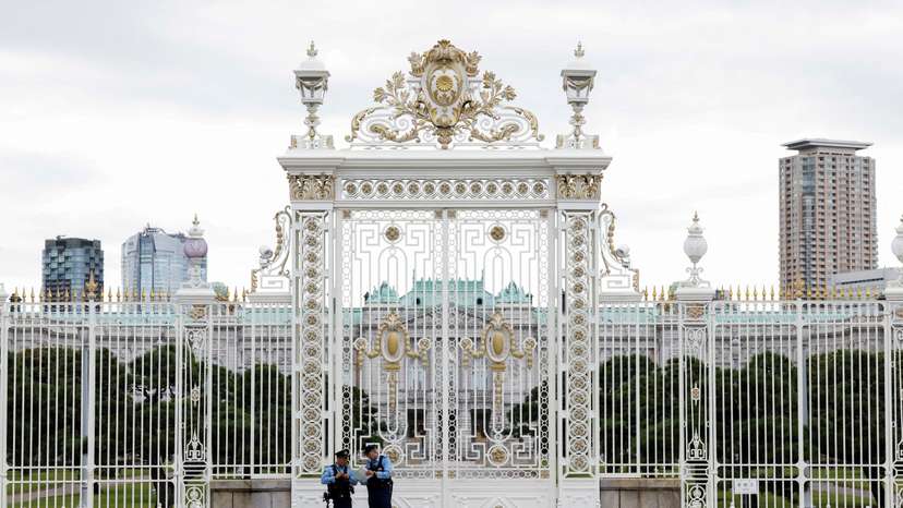 Police officers stand in front of the the Akasaka Palace State Guest House in Tokyo