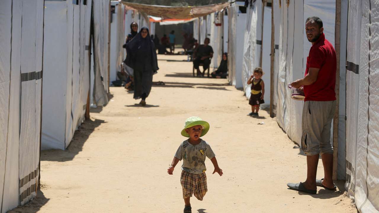 Displaced Palestinians with special needs shelter in a tent camp