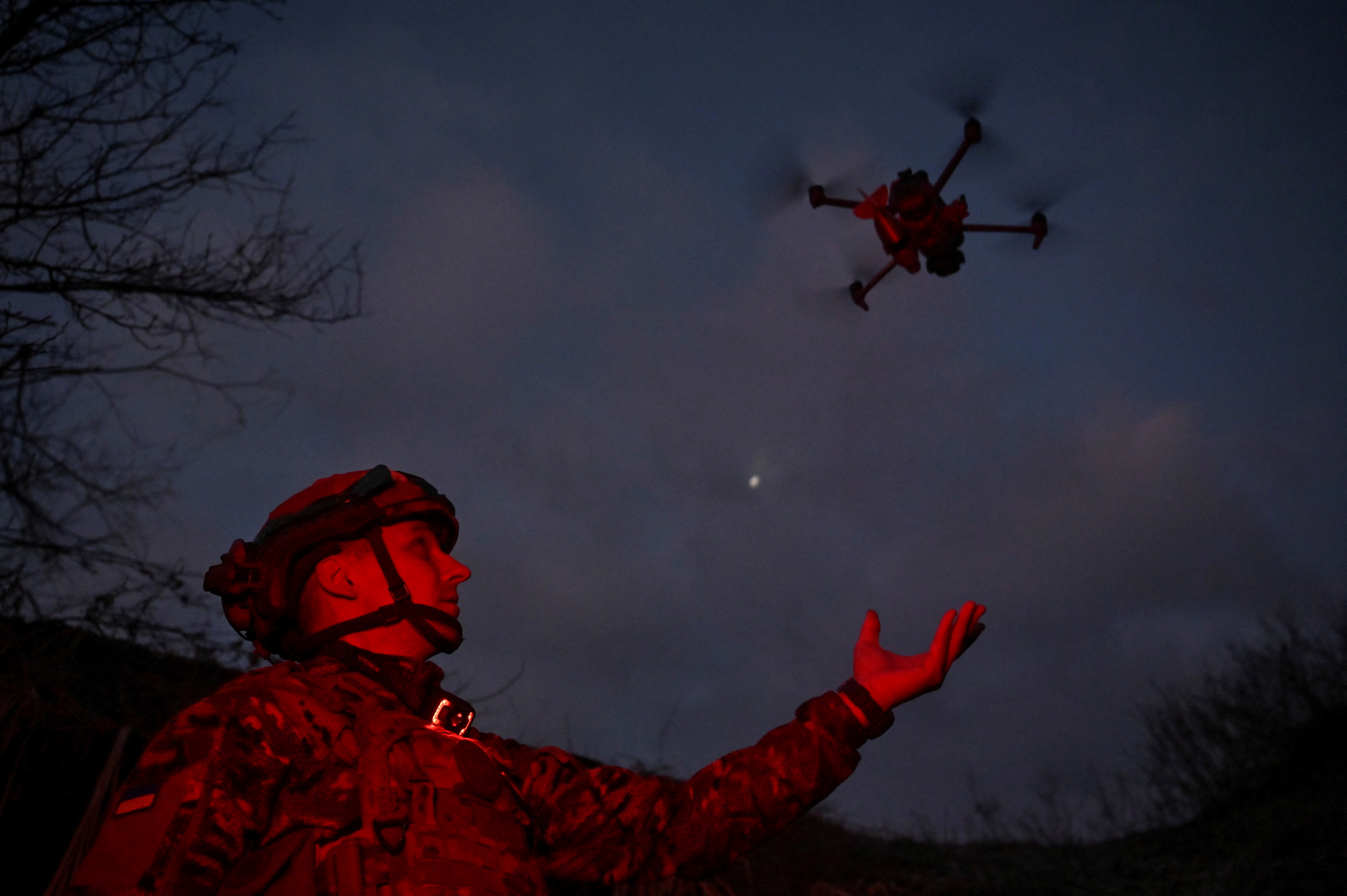 FILE PHOTO: Policeman of the 'Khyzhak' Brigade launches a drone at a position in a front line near the town of Toretsk