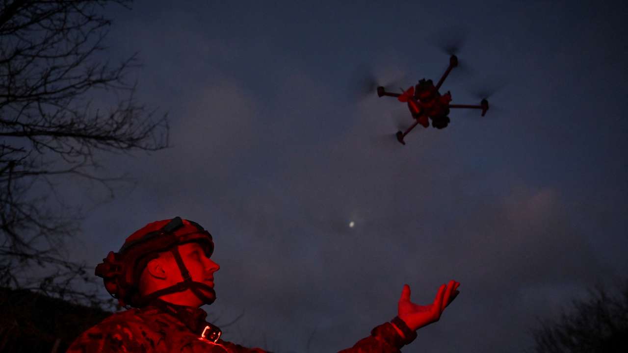 FILE PHOTO: Policeman of the 'Khyzhak' Brigade launches a drone at a position in a front line near the town of Toretsk