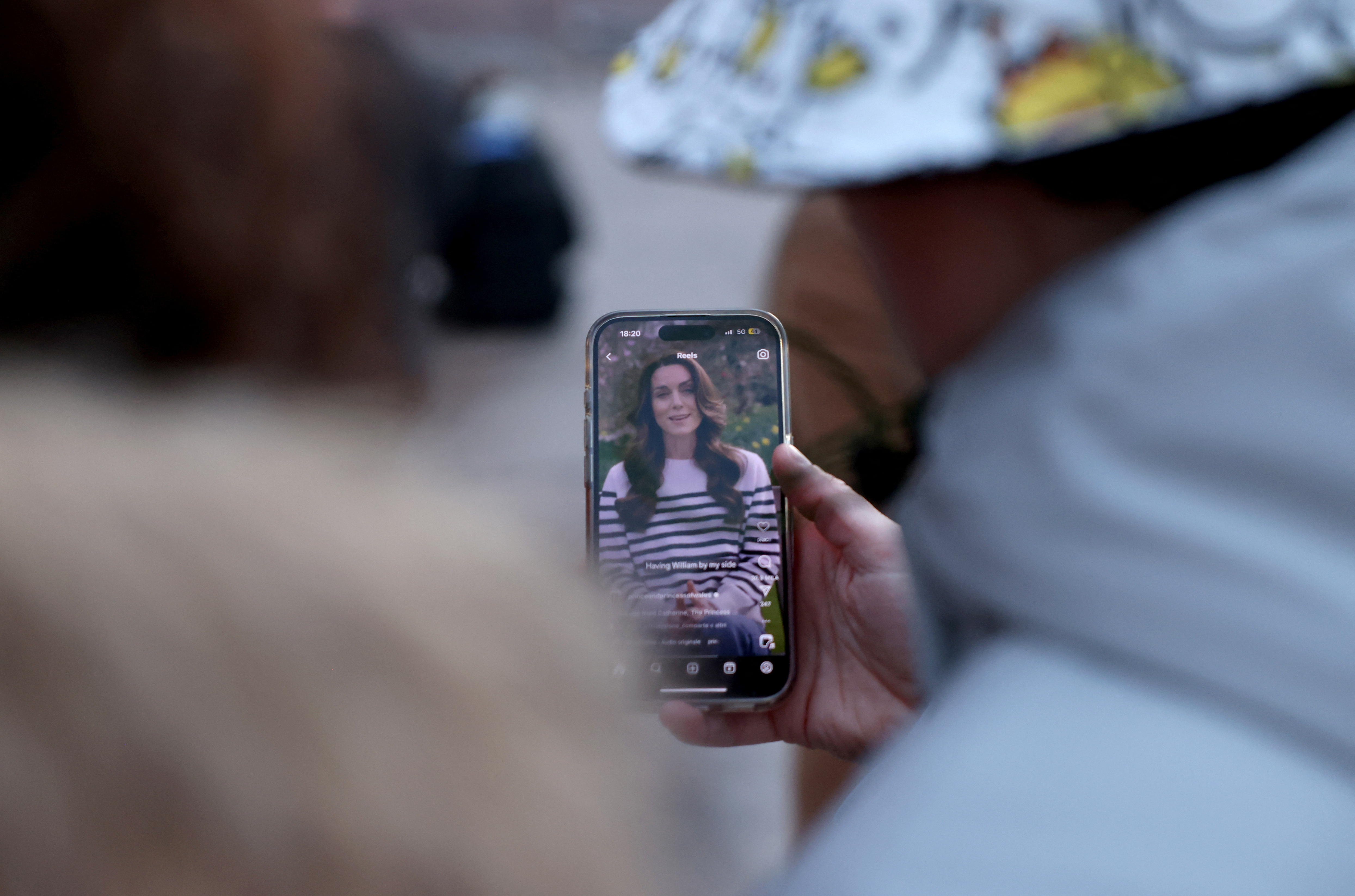 People gather outside Buckingham Palace in London