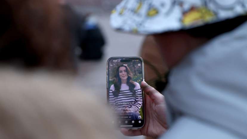 People gather outside Buckingham Palace in London