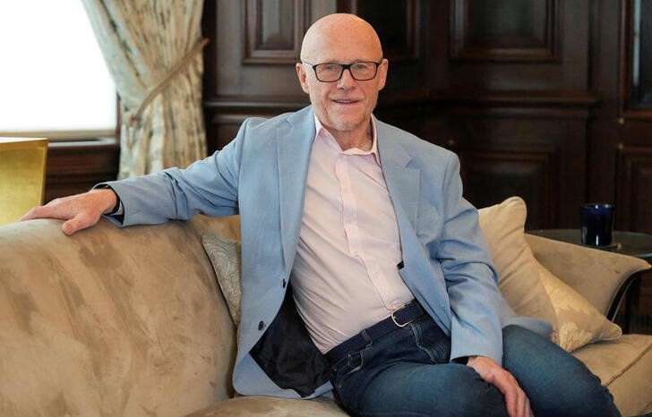 FILE PHOTO: John Caudwell, the billionaire founder of retailer Phones4u, poses for a photograph during an interview with Reuters in London