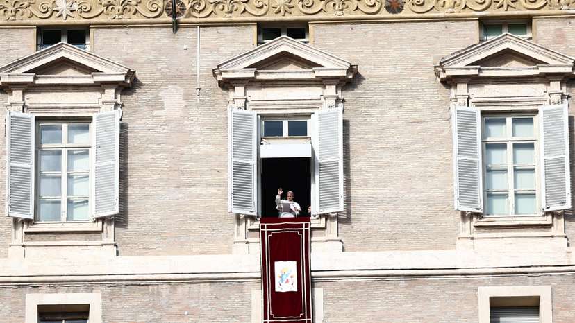 Pope Leo leads the Angelus prayer from the window of the Apostolic Palace at the Vatican