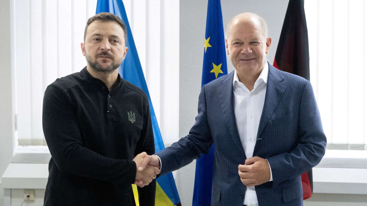 FILE PHOTO: German Chancellor Olaf Scholz and Ukrainian President Volodymyr Zelenskiy meet at the airoprt in Frankfurt