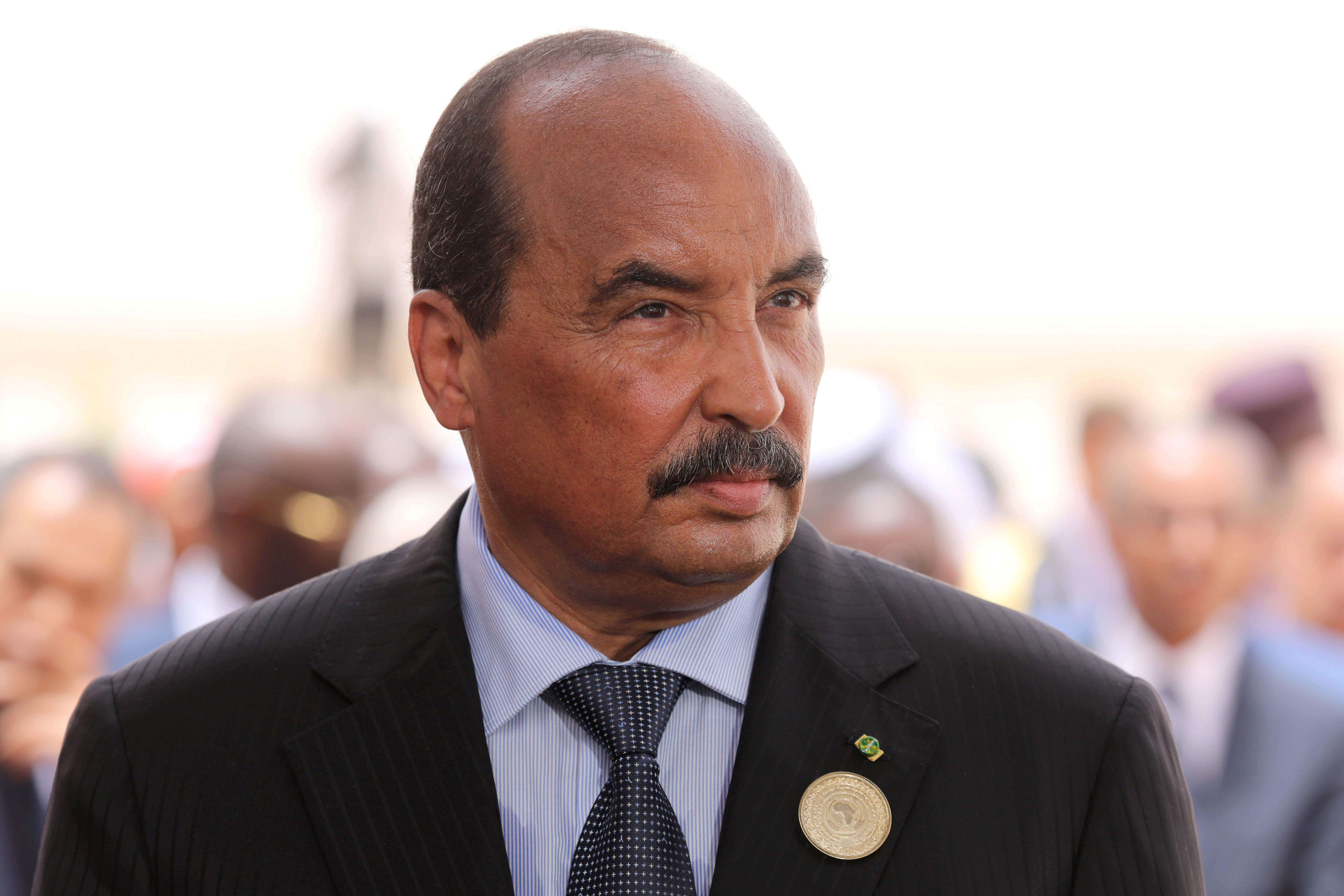 Mauritania's President Mohamed Ould Abdel Aziz waits for the arrival of the French President at Nouakchott airport