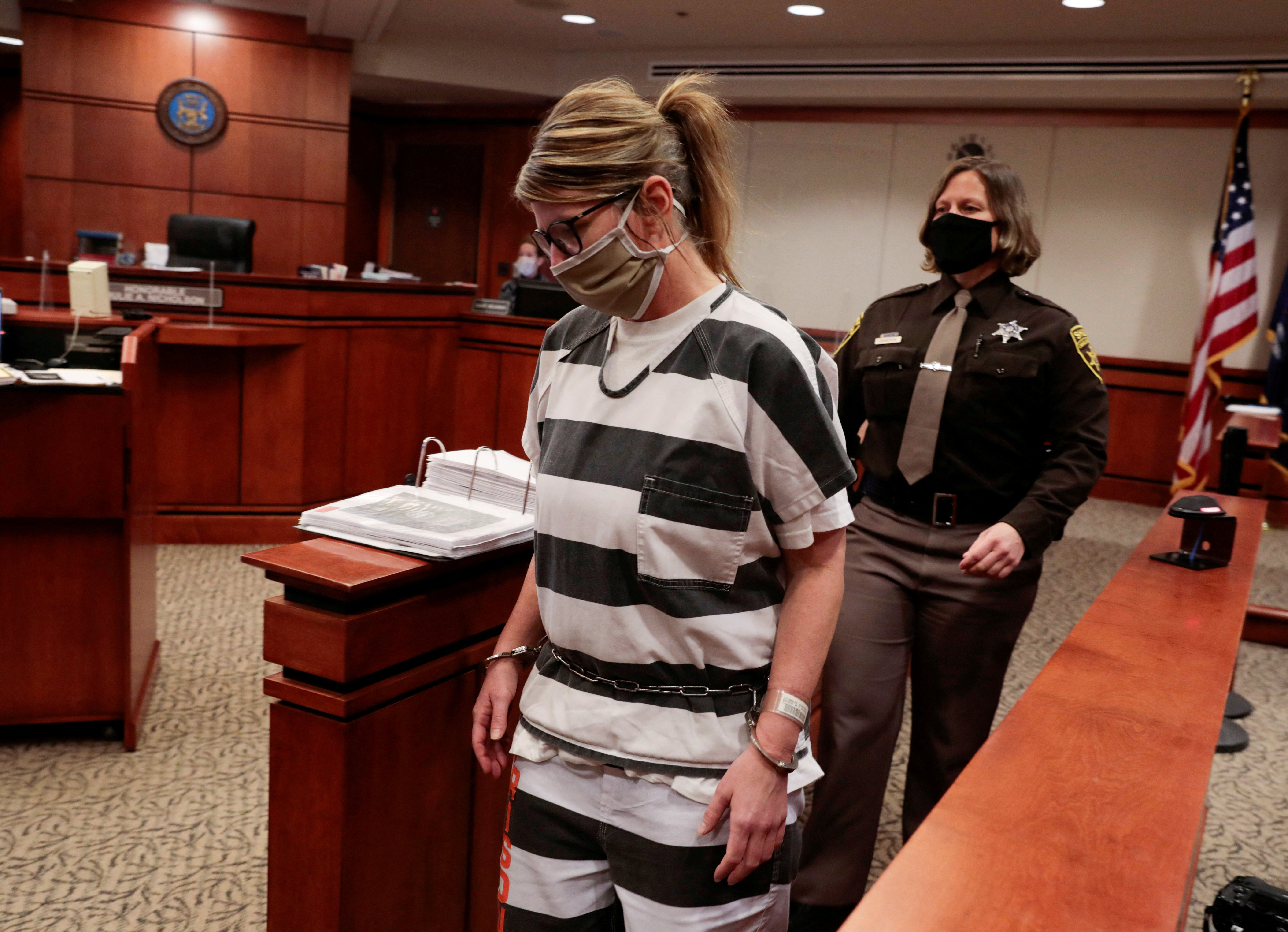 FILE PHOTO: Jennifer Crumbley, parent of accused Oxford High School gunman Ethan Crumbley, is escorted into the courtroom by a Oakland Count Sheriff