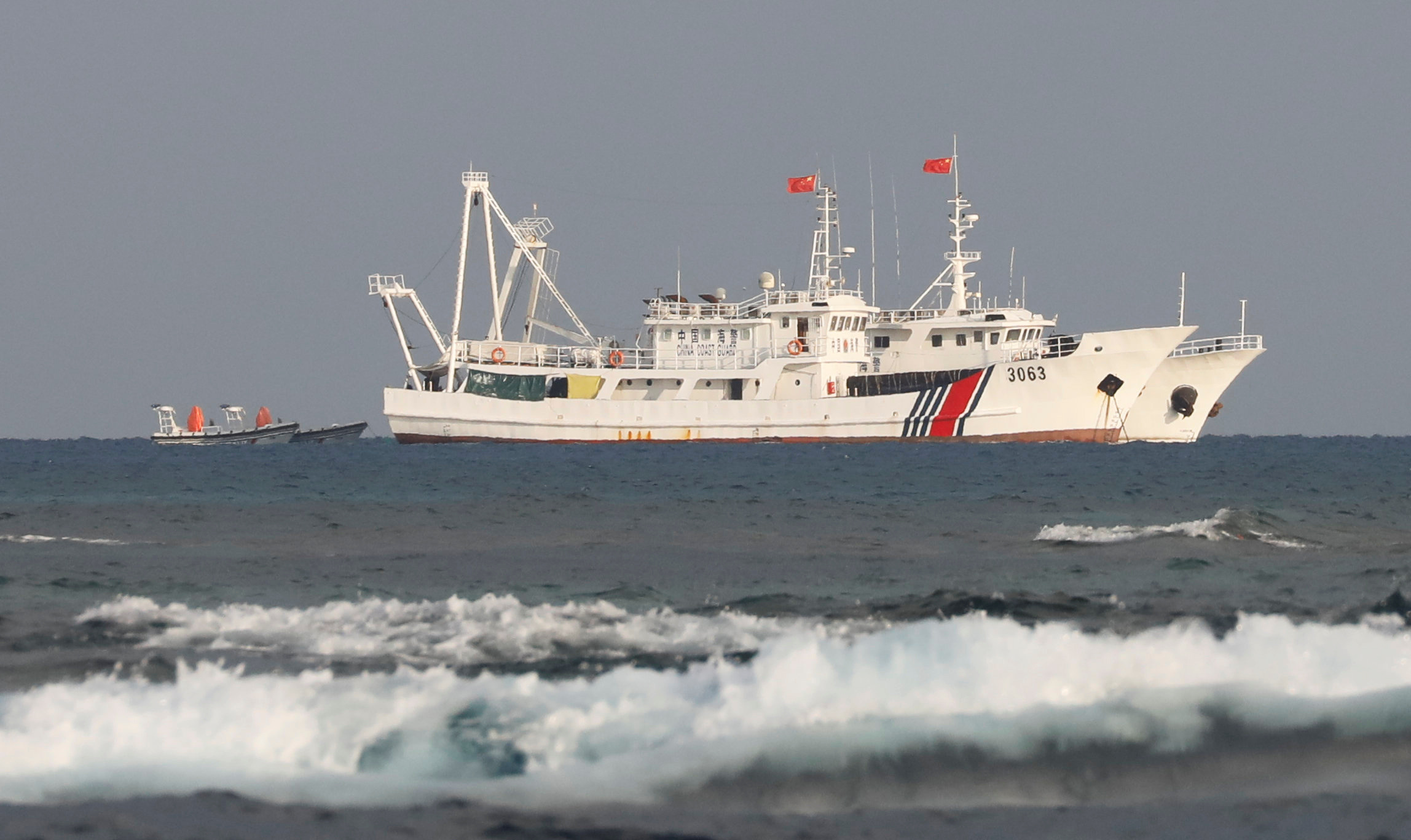 China Coast Guard vessels are pictured at the disputed Scarborough Shoal