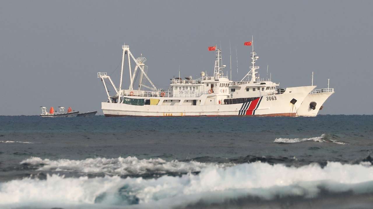 China Coast Guard vessels are pictured at the disputed Scarborough Shoal