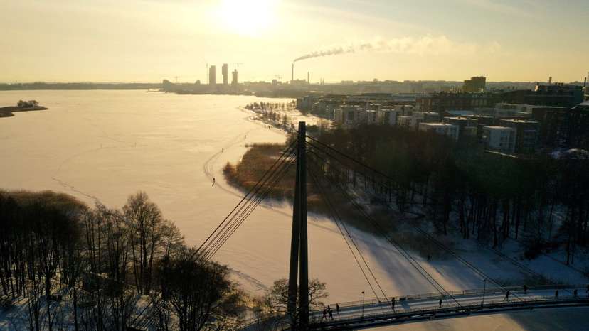 People walk during sunny weather in Helsinki