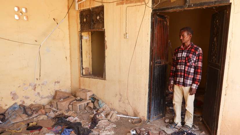 A Sudanees citizen Abdulilah Mohamed, from the Sharg Elnil area looks at to his destroyed and looted home at the Sharg Elnil area in the state of Khartoum