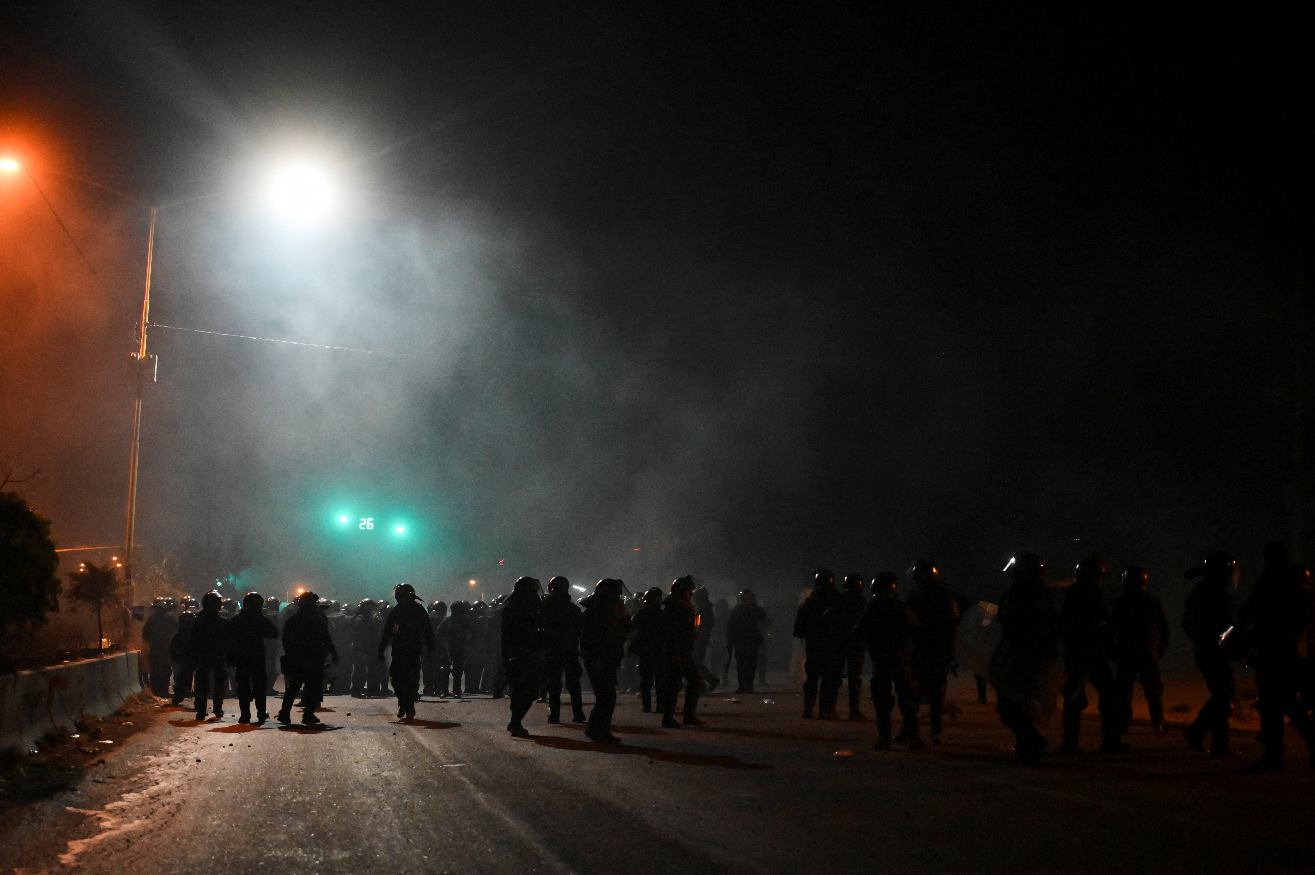 Police clash with the supporters of Morales during protests, in Cochabamba
