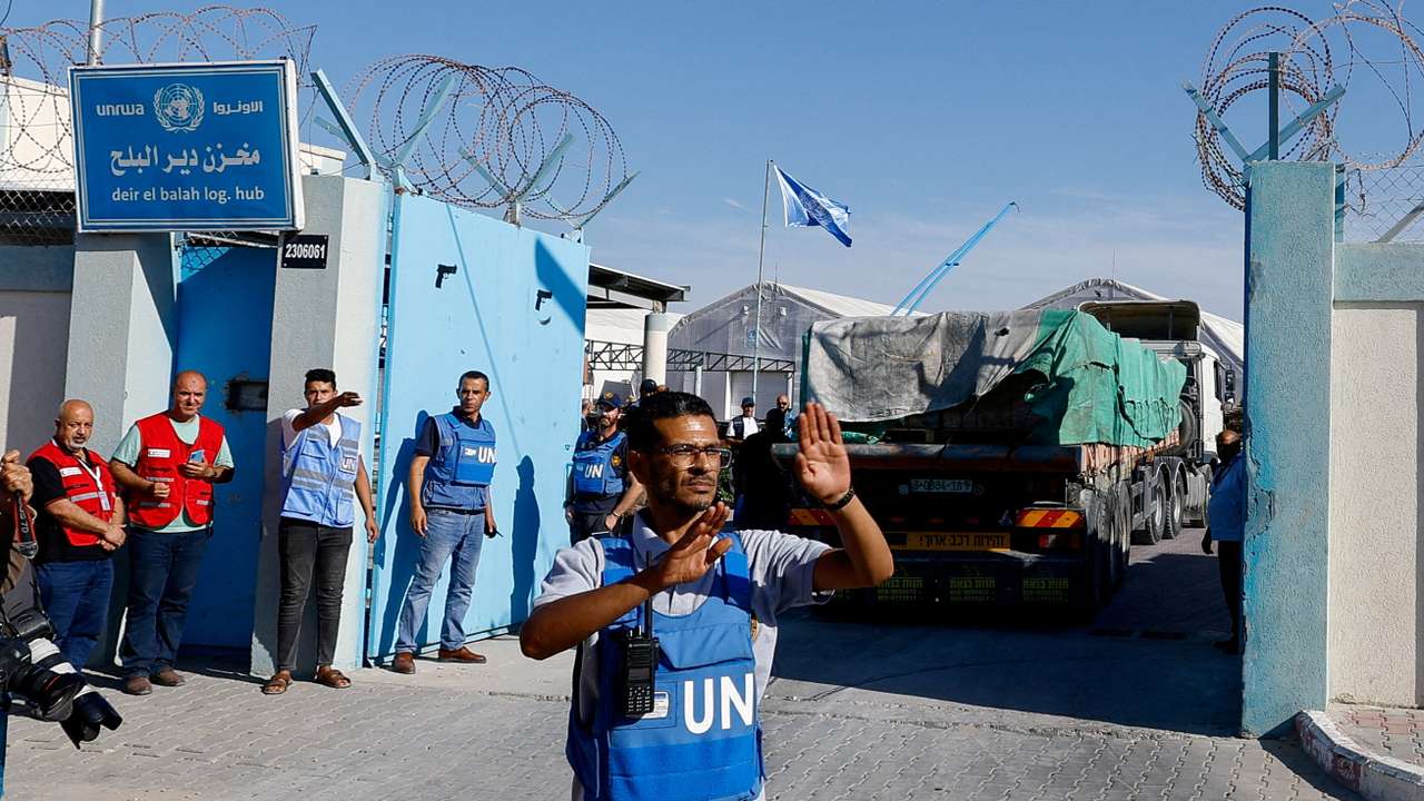 FILE PHOTO: Aid trucks arrive at a UN storage facility in the central Gaza Strip