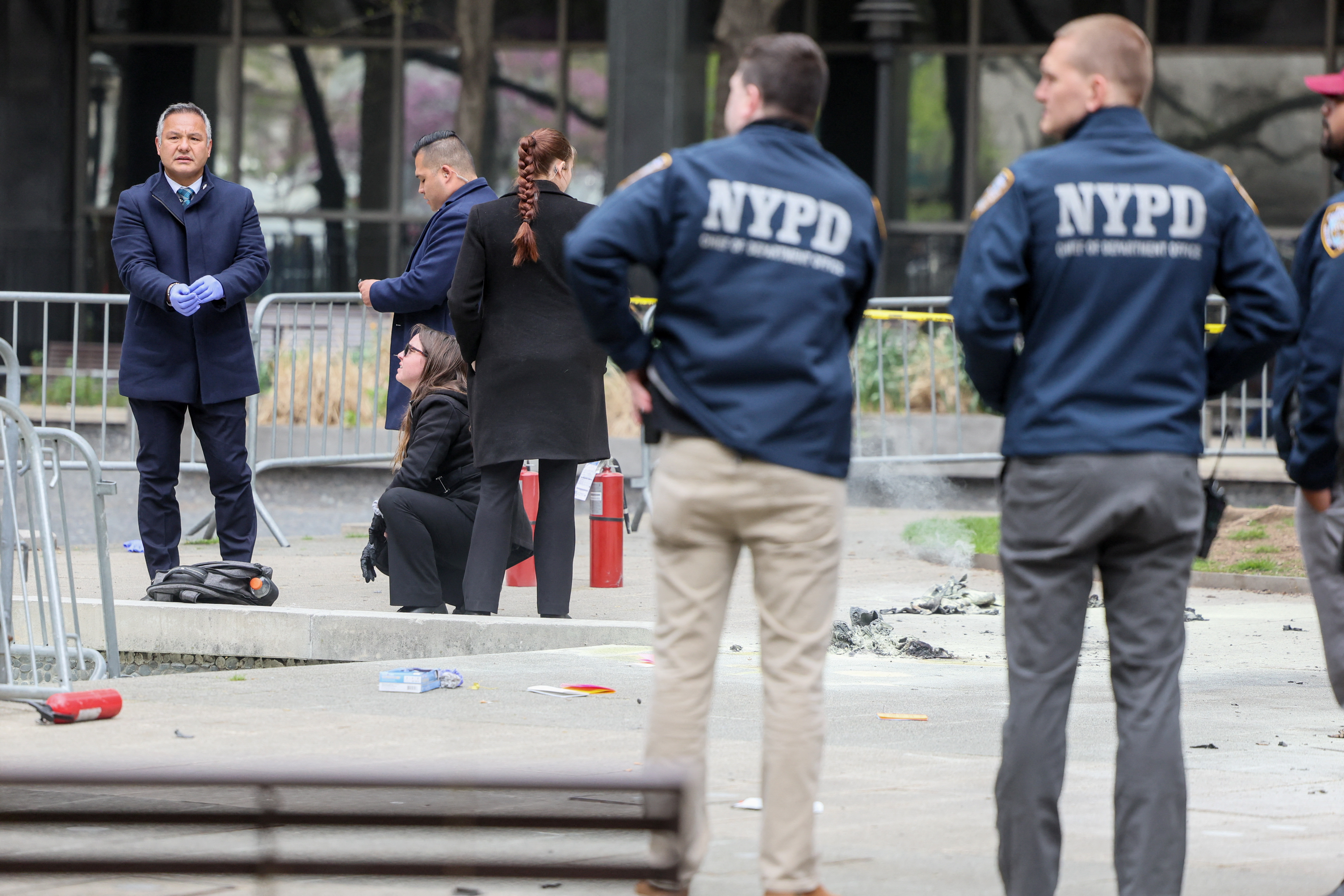 Aftermath of a person covered in flames outside NY courthouse of former U.S. President Trump's criminal hush money trial
