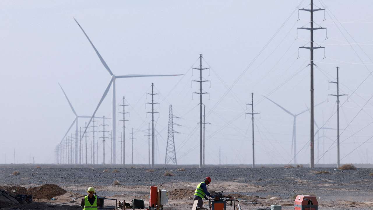 Workers work at a construction site at a Taiyuan New Energy Co wind farm