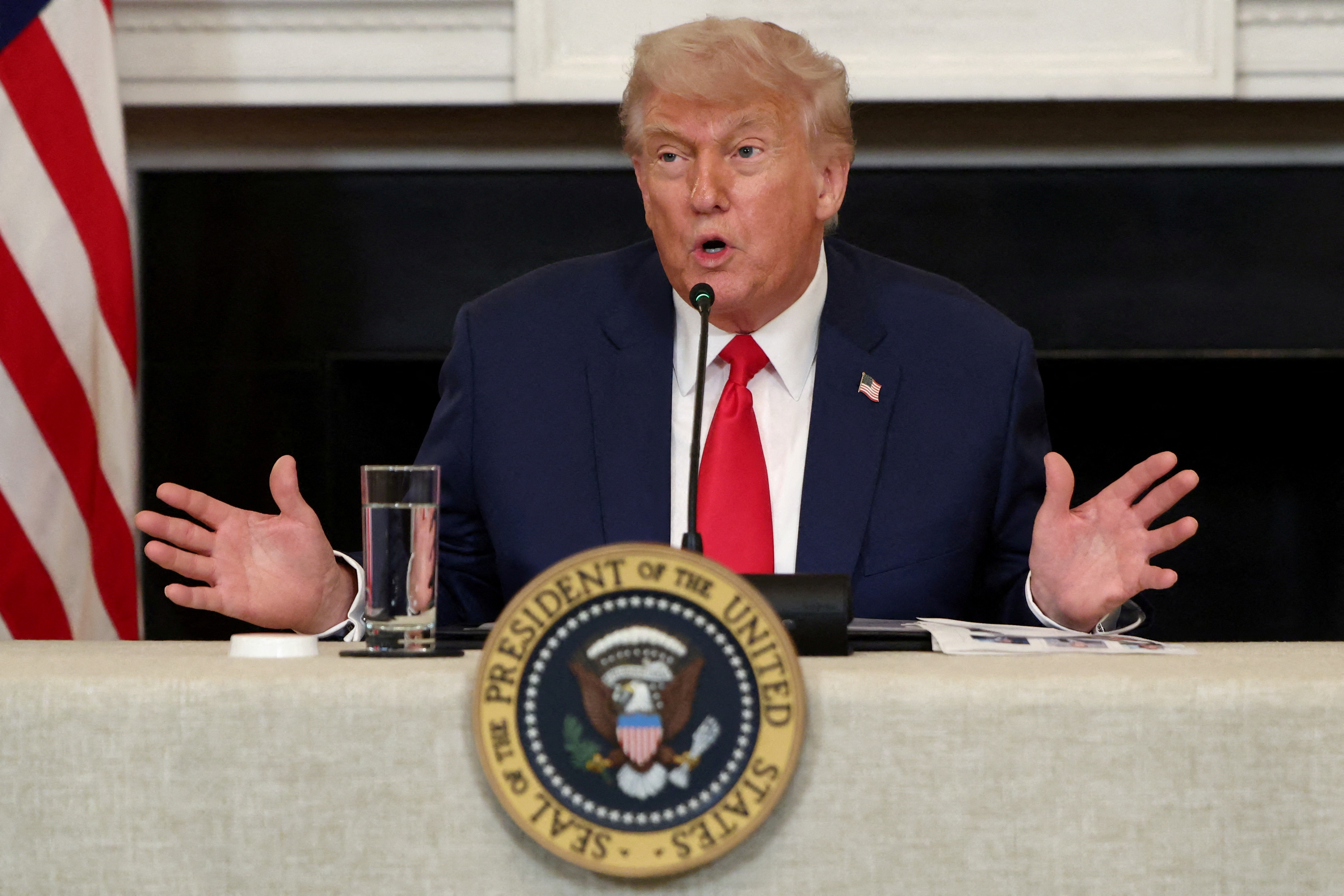 FILE PHOTO: U.S. President Donald Trump participates in an Invest America Roundtable, at the White House, in Washington