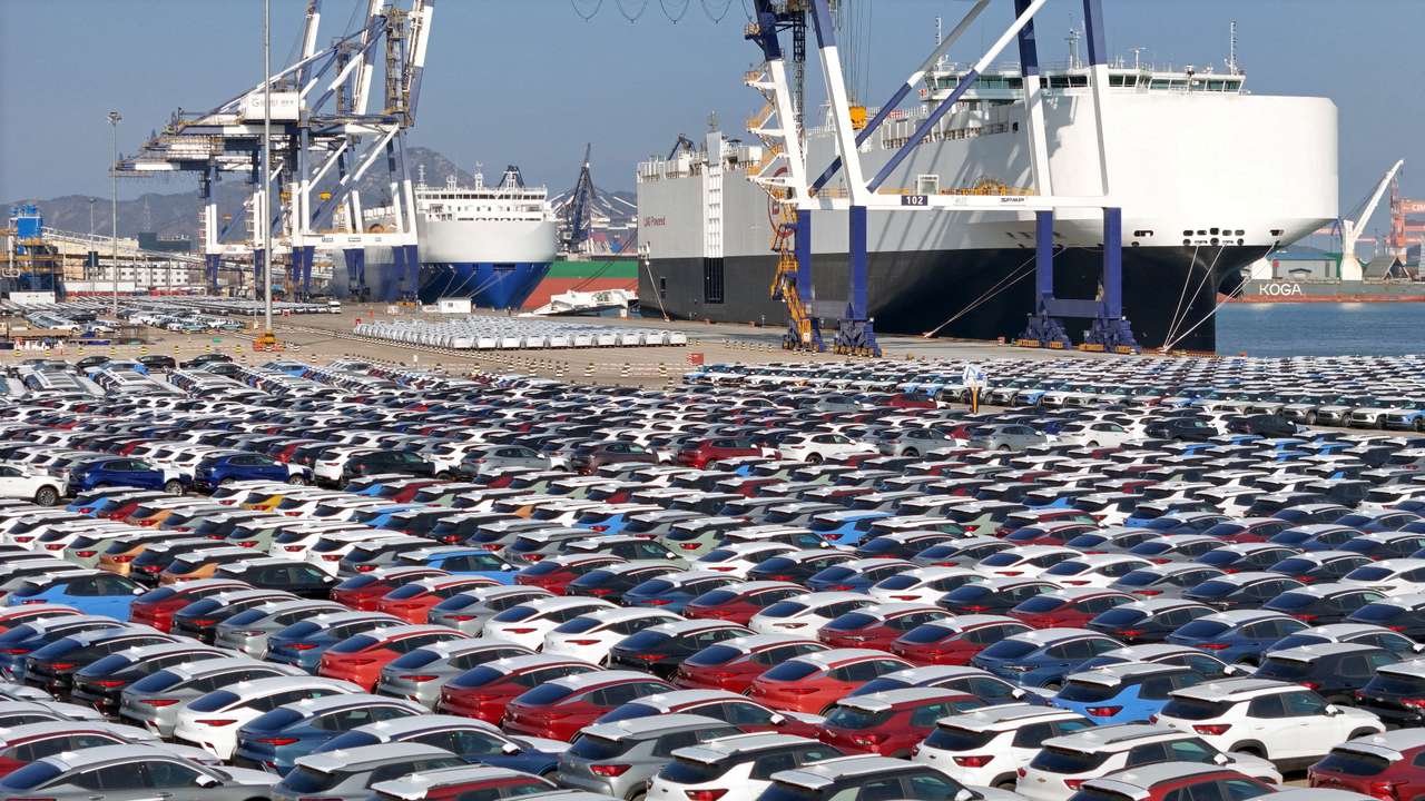 FILE PHOTO: Cars to be exported sit at a terminal in the port of Yantai, China