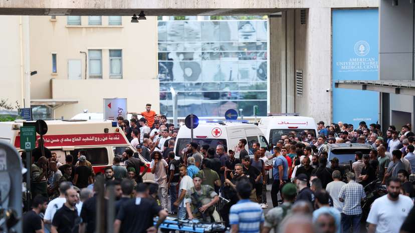 People gather outside a hospital, as more than 1,000 people, including Hezbollah fighters and medics, were wounded on Tuesday when the pagers they use to communicate exploded across Lebanon, according to a security source, in Beirut
